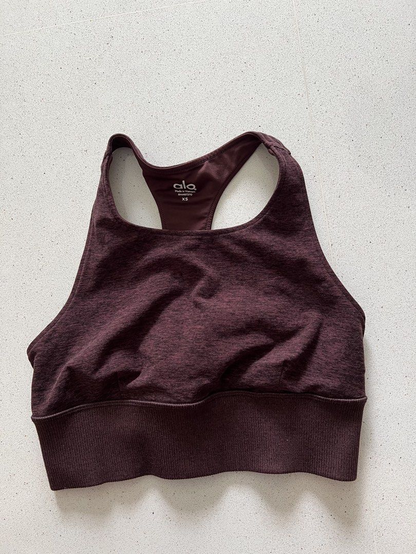 Alo Yoga Sports Bra XS Burgundy Heathered Racerback (Category: Activewear) located in Singapore. Submitted by canofwho (Listing ID 1443995915, Image 1). Description: - Brand: Alo Yoga - Color: Burgundy Heathered - Style: Racerback - Features: Ribbed band at the bottom - Size: XS - Versatile: Great for workouts or everyday wear.