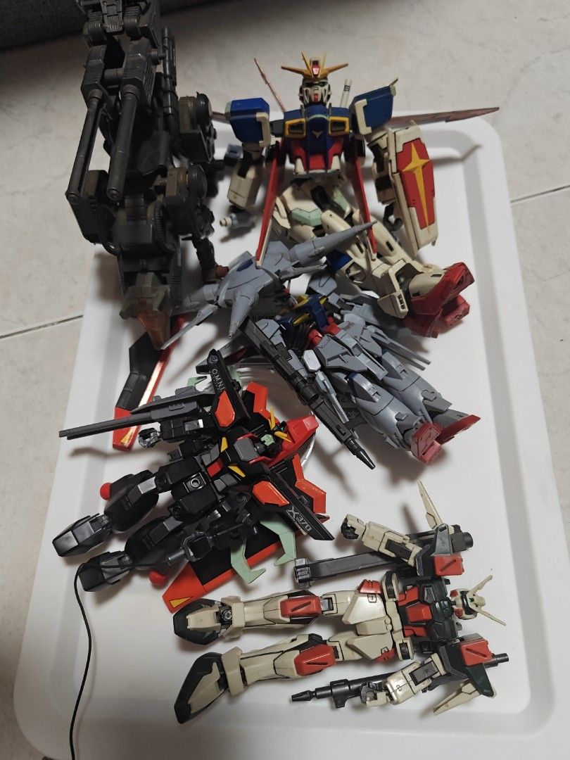 Assorted Gundam Model Kits - Various Mobile Suits (Category: Gundam Model Kits) located in Singapore. Submitted by tianpoh (Listing ID 1444055890, Image 1). Description: Selling assembled Gundams, you can practise for detailing and painting. - 3x HG Models $5 each (buster, raider& providance) - 2x MG, 1/100 Models $12 each MG strike gundam & 1/100 legend - 1x MG RX-178 MK II ($25) Very good condition..