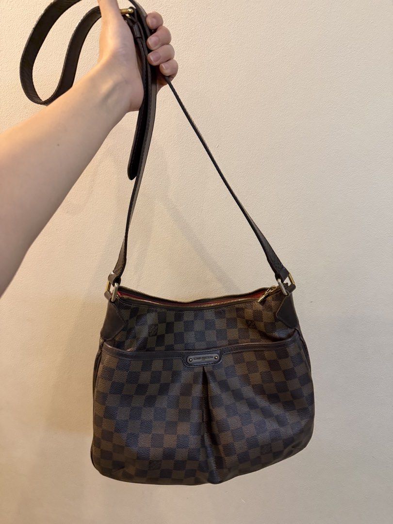 Authentic Louis Vuitton Damier Ebene Bloomsbury (Category: Luxury Bags & Wallets) located in Quezon City. Submitted by purpleblush (Listing ID 1444034613, Image 3). Description: Louis Vuitton Damier Ebene Bloomsbury PM Classic Louis Vuitton shoulder bag in Damier Ebene coated canvas with brown leather trim and gold-tone hardware. Features an adjustable shoulder strap, zip-top closure, spacious interior, and signature front pleated pocket detail. 