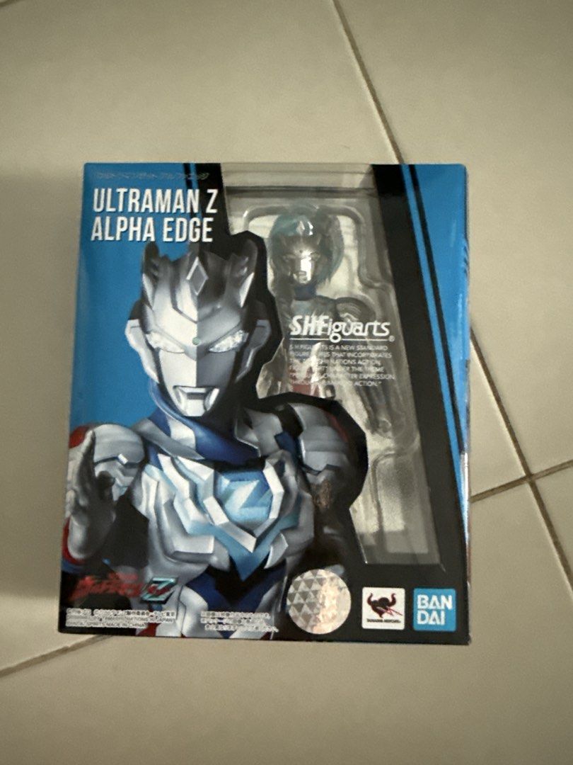 Bandai SHFiguarts Ultraman Z Alpha Edge Action Figure (Category: Toy Figures) located in Singapore. Submitted by cp2tkmtnc551575 (Listing ID 1443956718, Image 1). Description: - Bandai SHFiguarts Ultraman Z Alpha Edge action figure - Authentic collectible - Features Ultraman Z in his Alpha Edge form - Figure visible in packaging - Ideal for Ultraman enthusiasts.