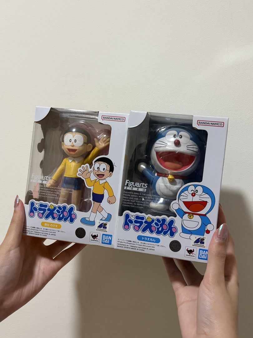 Bandai Tamashii Nations Figuarts Doraemon & Nobita Figures (Category: Toy Figures) located in Singapore. Submitted by angrypiplup (Listing ID 1444036307, Image 1). Description: - Bandai Tamashii Nations Figuarts figures - Set includes Doraemon and Nobita Nobi - Imported from Japan - Comes with option parts - Ideal for collectors.