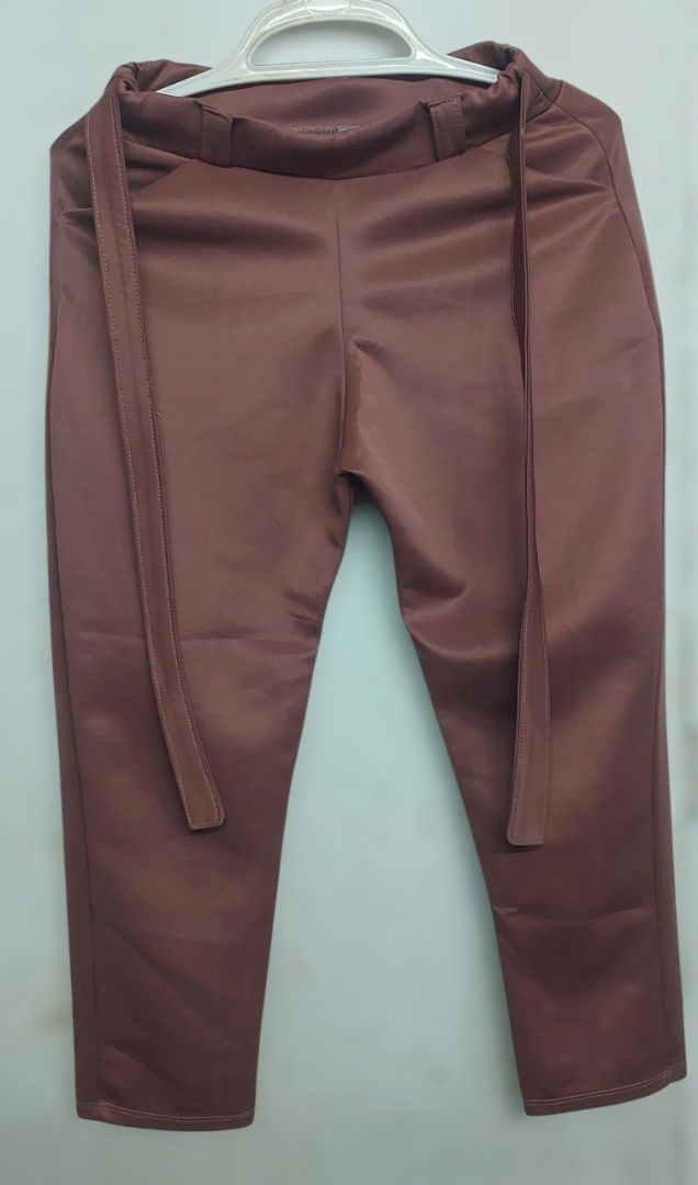 Beige and Brown Satin Pants with Belt (Category: Other Bottoms) located in General Trias. Submitted by isaki_21 (Listing ID 1443969739, Image 2). Description: Buy 2 for 200 Condition: Likely used Size: Can fit to 24 - 28 waistline.