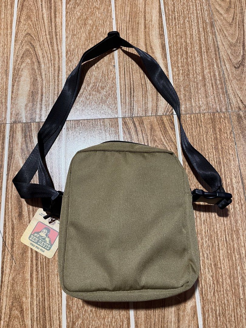 Ben Davis Crossbody Bag Khaki (Category: Sling Bags) located in Manila. Submitted by mjaothrift (Listing ID 1444066227, Image 3). Description: - Ben Davis crossbody bag - Color: Khaki - Front buckle pocket - Mesh side pocket - Adjustable strap - Ideal for everyday use - Comes with original tags.