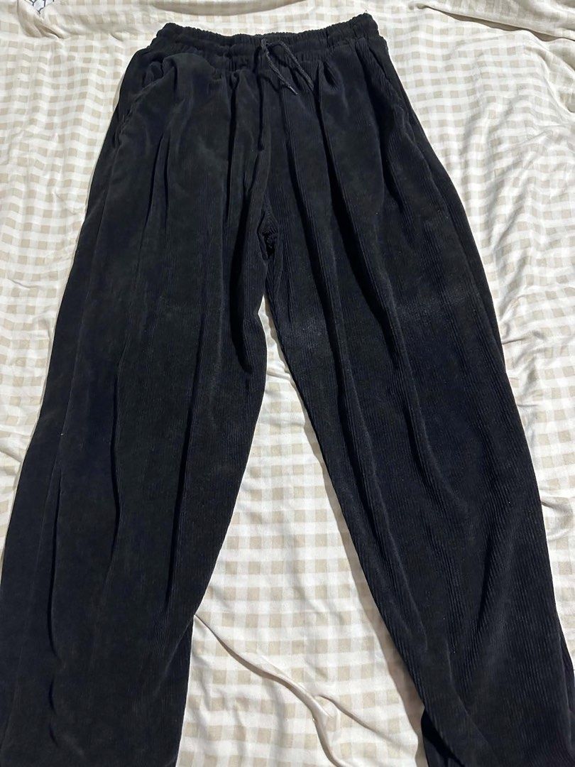 Black Corduroy Pants with Drawstring Waist (Category: Other Bottoms) located in Manila. Submitted by usedstuffs (Listing ID 1443957523, Image 1). Description: - Black corduroy fabric - Wide leg fit - Drawstring waist for adjustable comfort - Convenient side pockets - Comfortable and casual design - Versatile for everyday wear and easy styling.