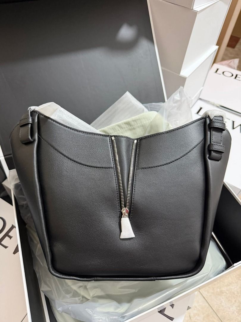 Black Leather Hammock Bag (Category: Luxury Bags & Wallets) located in Marilao. Submitted by shopforyouph (Listing ID 1443957679, Image 1). Description: Soft leather with a unique zippered front. Spacious interior with a detachable strap. Comes with dust bag and box..