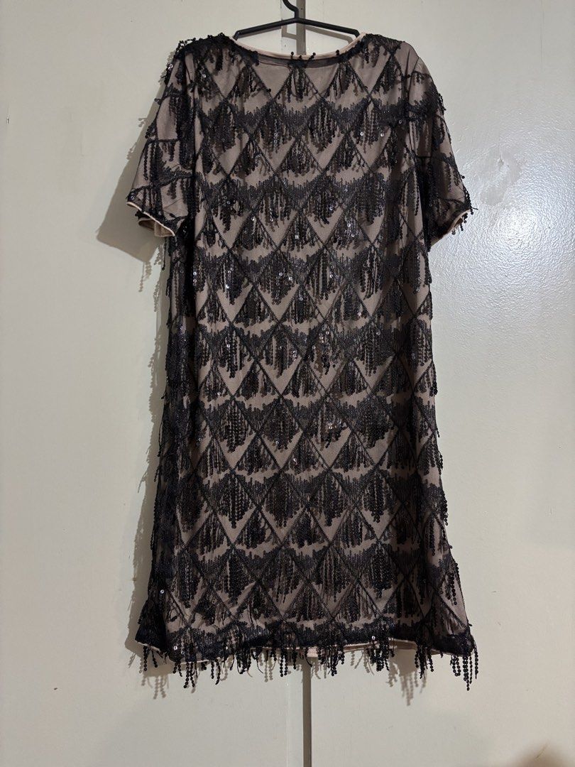 Black Sequin Fringe Flapper Dress (Category: Dresses) located in Mandaluyong City. Submitted by carol_0368 (Listing ID 1443980363, Image 1). Description: - Stunning black sequin and fringe dress - Short sleeves for a comfortable fit - Nude lining for opacity and comfort - Ideal for parties, nights out, or any festive occasion - Fun and flirty design that's sure to turn heads - Approximate measurements: X inches long, X inches wide.