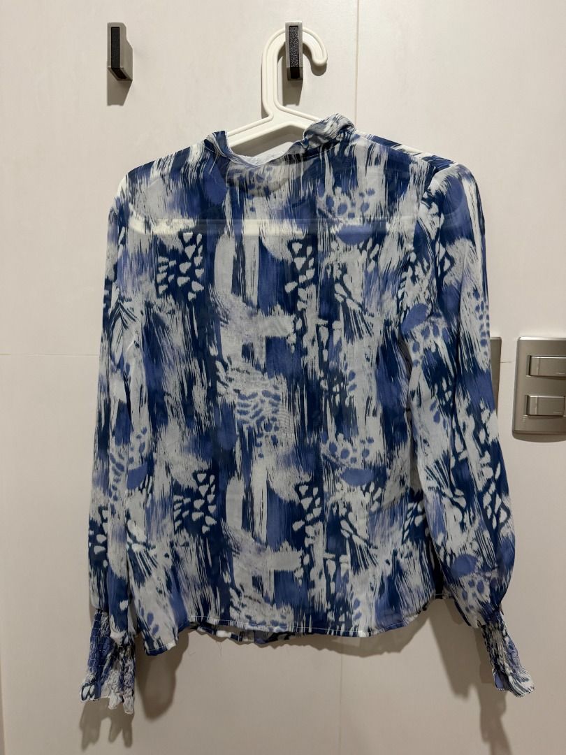 Blue Abstract Print Sheer Long Sleeve Blouse (Category: Blouses) located in Mandaluyong City. Submitted by kayechx (Listing ID 1444075934, Image 2). Description: - Sheer long sleeve blouse - Eye-catching blue abstract print - Elegant high neckline with tie detail - Ruffled trim on neckline and cuffs - Comfortable elasticated cuffs - Lightweight fabric, perfect for layering or standalone wear can give 10% discount if you purchase 3 or more items f