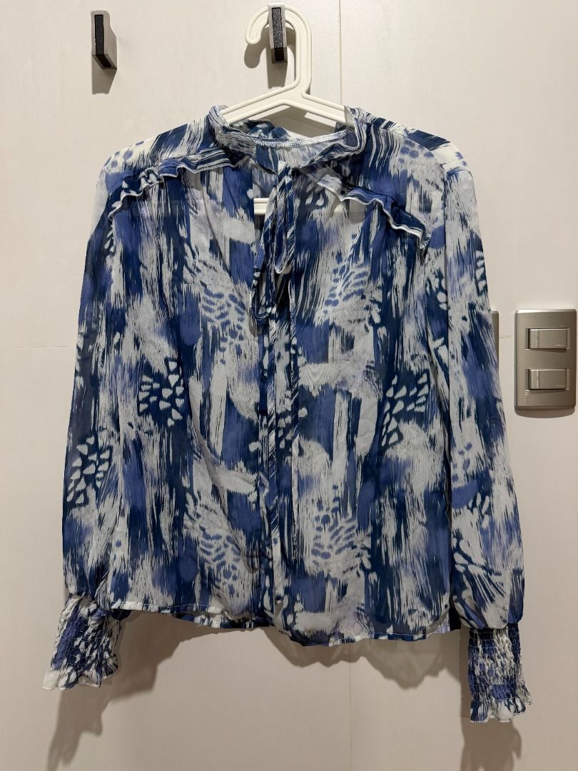 Blue Abstract Print Sheer Long Sleeve Blouse (Category: Blouses) located in Mandaluyong City. Submitted by kayechx (Listing ID 1444075934, Image 1). Description: - Sheer long sleeve blouse - Eye-catching blue abstract print - Elegant high neckline with tie detail - Ruffled trim on neckline and cuffs - Comfortable elasticated cuffs - Lightweight fabric, perfect for layering or standalone wear can give 10% discount if you purchase 3 or more items f