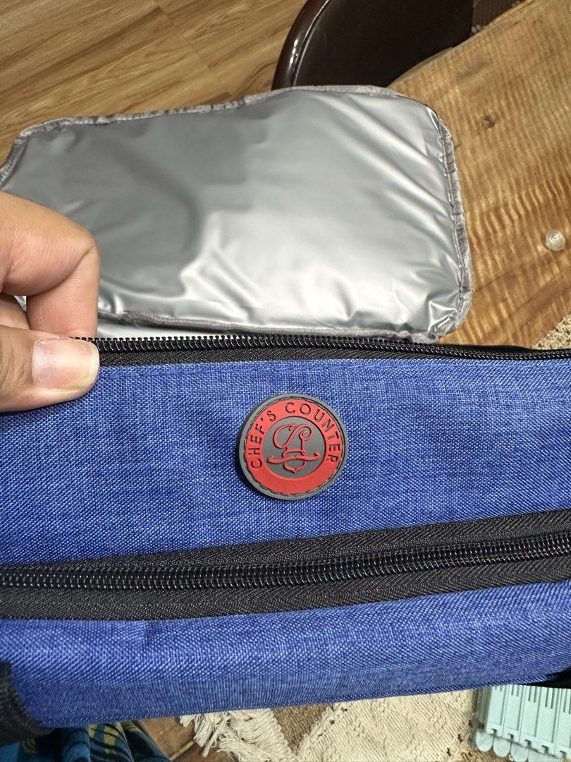 Chef's Counter Blue Insulated Lunch Bag (Category: Food Organization & Storage) located in Porac. Submitted by prelovedanddeclutter (Listing ID 1443975802, Image 2). Description: Blue insulated lunch bag from Chef's Counter. Great for keeping food cool or warm. Has a main compartment and a top compartment. Zippers work well. Handles are sturdy. Good for work or school lunches..