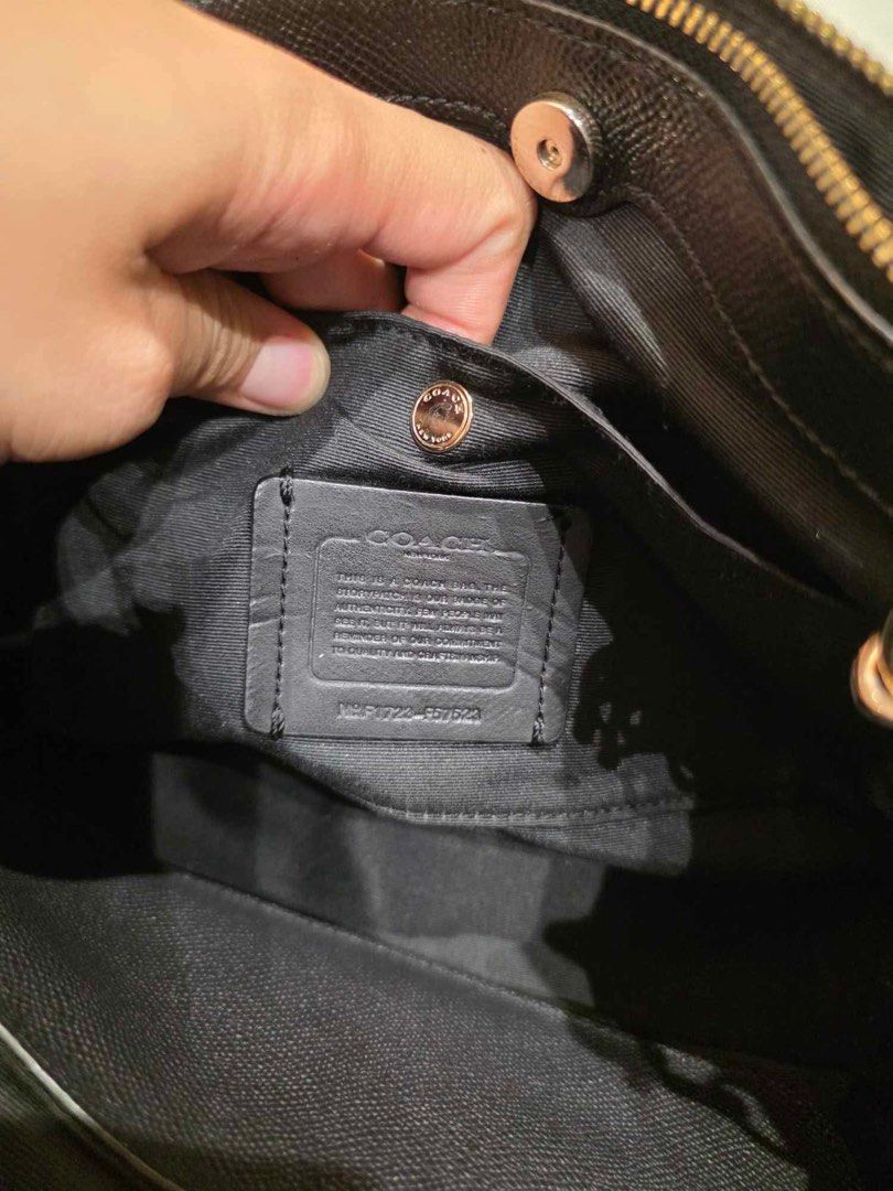 Coach Black Pebbled Leather Satchel Bag (Category: Luxury Bags & Wallets) located in Taytay. Submitted by shopbye (Listing ID 1444020311, Image 2). Description: - Genuine black pebbled leather Coach satchel - Elegant gold hardware details - Versatile with top handles and a detachable crossbody strap - Multiple interior compartments for organization - Ideal everyday bag.
