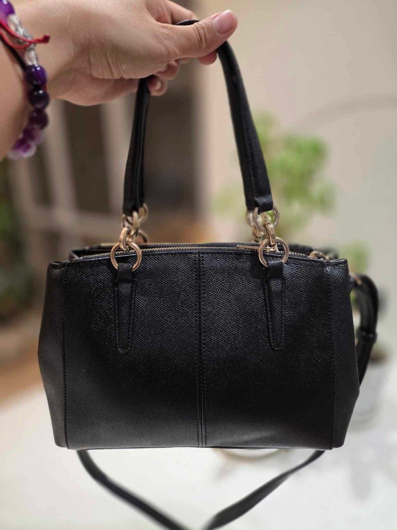 Coach Black Pebbled Leather Satchel Bag (Category: Luxury Bags & Wallets) located in Taytay. Submitted by shopbye (Listing ID 1444020311, Image 3). Description: - Genuine black pebbled leather Coach satchel - Elegant gold hardware details - Versatile with top handles and a detachable crossbody strap - Multiple interior compartments for organization - Ideal everyday bag.