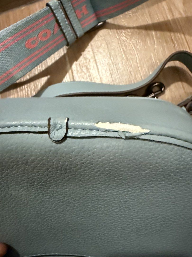 Coach Light Blue Leather Saddle Bag with Striped Strap (Category: Luxury Bags & Wallets) located in Taguig. Submitted by love_1993 (Listing ID 1444007154, Image 3). Description: - Light blue Coach saddle bag - Genuine pebbled leather - Detachable crossbody strap with blue/pink stripe and 'Coach' lettering - Clean interior - Smooth working zipper.