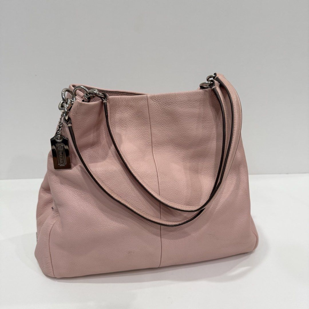 Coach Madison Phoebe Pink Leather Shoulder Bag (Category: Luxury Bags & Wallets) located in Paranaque City. Submitted by missb1001 (Listing ID 1444031244, Image 1). Description: Overall Condition: 9.5/10 Leather body: 9.5/10 Silver Hardware: 10/10 Rank A-AB - in very good condition Issues: Light signs of use on the leather body, with an ink mark inside one of the slip pockets (see photos for details). With provided generic dust bag 🌸 pretty colo