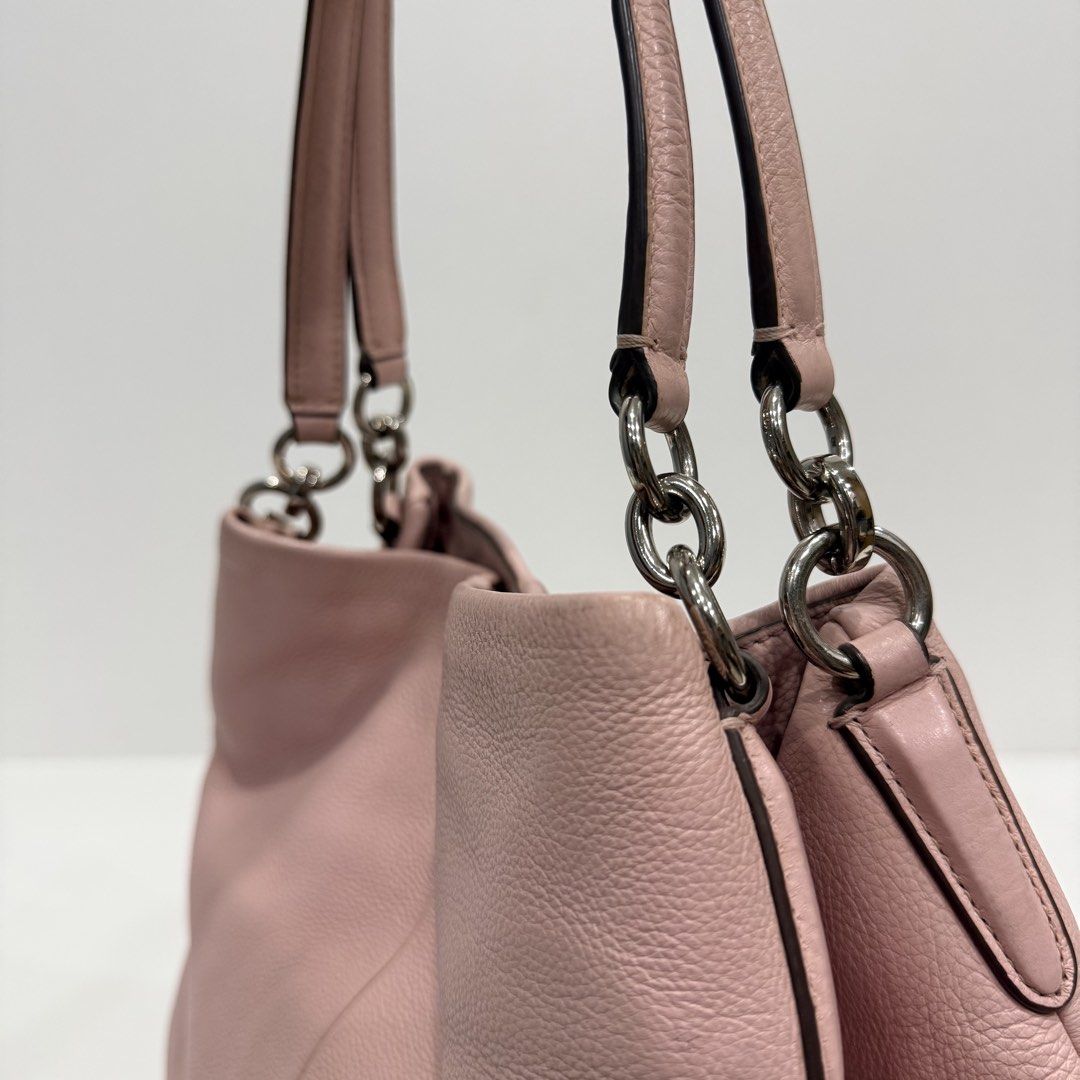 Coach Madison Phoebe Pink Leather Shoulder Bag (Category: Luxury Bags & Wallets) located in Paranaque City. Submitted by missb1001 (Listing ID 1444031244, Image 3). Description: Overall Condition: 9.5/10 Leather body: 9.5/10 Silver Hardware: 10/10 Rank A-AB - in very good condition Issues: Light signs of use on the leather body, with an ink mark inside one of the slip pockets (see photos for details). With provided generic dust bag 🌸 pretty colo
