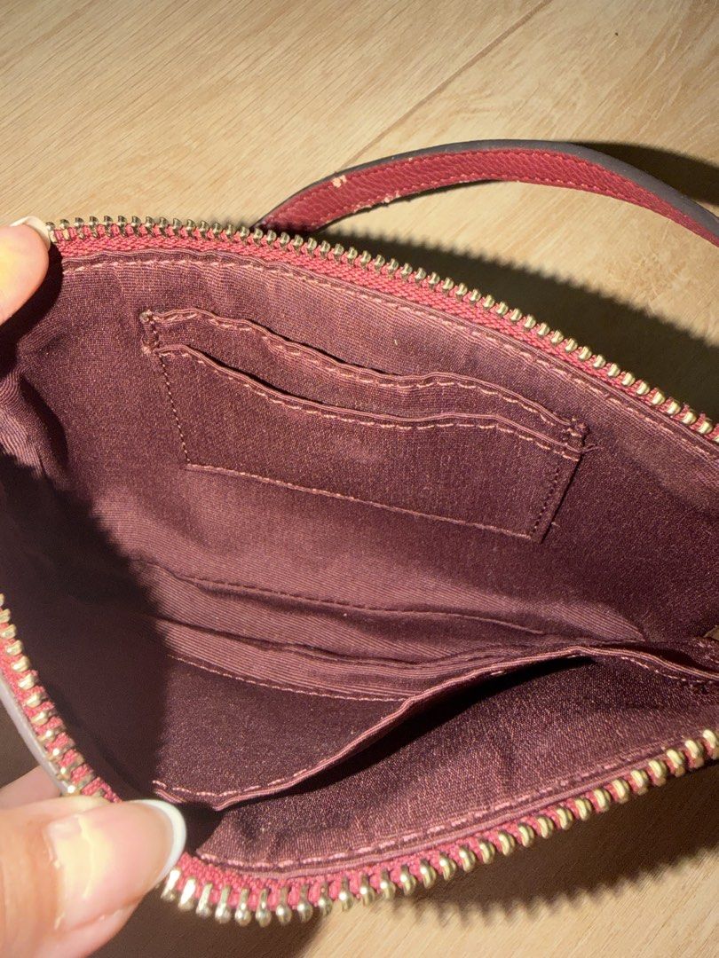 Coach Monogram Baguette Bag (Category: Luxury Bags & Wallets) located in Santa Rosa. Submitted by decluttering_. (Listing ID 1443922139, Image 3). Description: Rfs: decluttering MOP: Gcash MOD: Lalamove/Jnt - authentic coach - Features a cute floral pattern - Burgundy trim and interior - Includes card slots inside - Detachable pearl charm strap - Gold hardware - Ideal for carrying your essentials.
