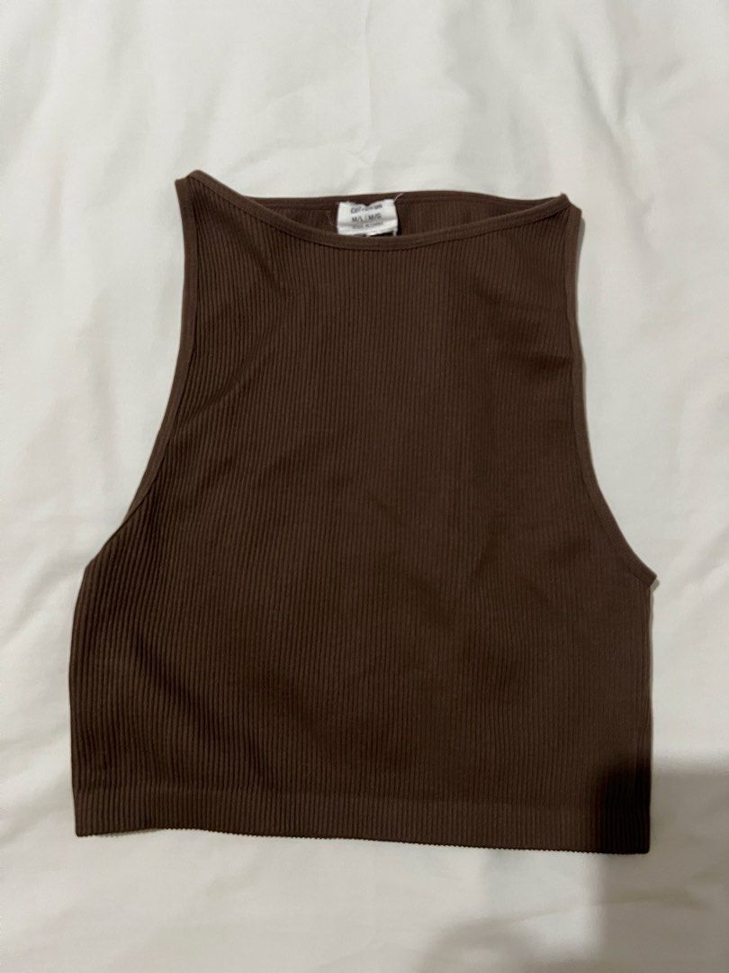 Cotton On Ribbed Tank Top - Brown (Category: Sleeveless) located in Pasig City. Submitted by shop.rdm (Listing ID 1444084933, Image 1). Description: - Brand: Cotton On - Color: Brown - Style: Ribbed tank top - Features: High neckline, sleeveless - Material: Stretchy for comfort - Versatile: Great for layering or wearing alone - Easy to style: Pairs well with jeans or shorts.