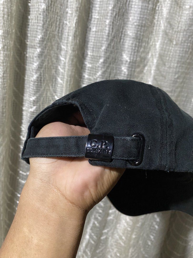 C.P. Company Black Cotton Baseball Cap (Category: Caps & Hats) located in Aurora. Submitted by sidethrift.deer (Listing ID 1444023671, Image 2). Description: - Brand: C.P. Company - Color: Black - Material: Cotton - Features: Adjustable strap at the back with C.P. Company logo - Sizing: One size fits all - Style: Great for everyday wear - Condition: Please check photos for details.