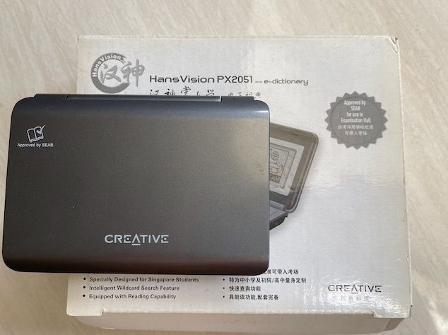 Creative Technology Mandarin E-Dictionary (Category: Stationery & School Supplies) located in Singapore. Submitted by ambersand (Listing ID 1443941311, Image 2). Description: - Full QWERTY keyboard - Includes earbuds and cables - Buttons for Chinese characters, switch, directory, explanation, input method, pronunciation - Compact and portable design - Great for language learning or travel.