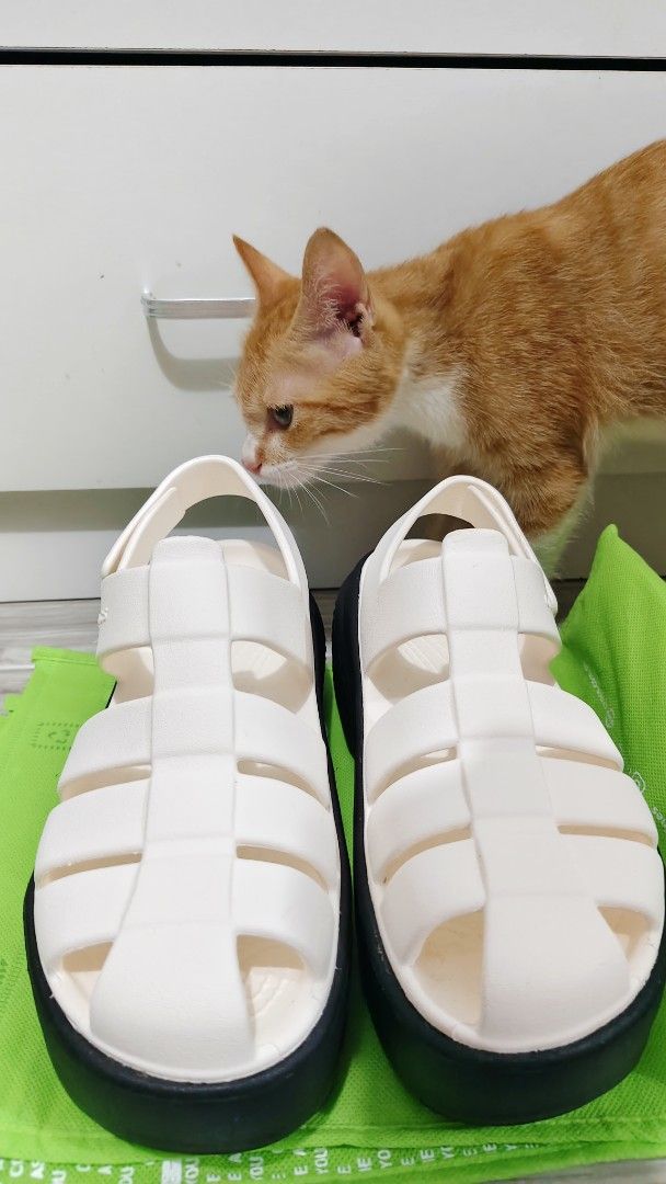 Original Crocs White Fisherman Platform Sandals (Category: Flats & Sandals) located in Imus. Submitted by qeanutdutter (Listing ID 1444102649, Image 1). Description: - White Crocs Fisherman Platform Sandals - Ideal for casual wear. Used once. - Size: 7. I have 24.5cm wide feet, fits me well..