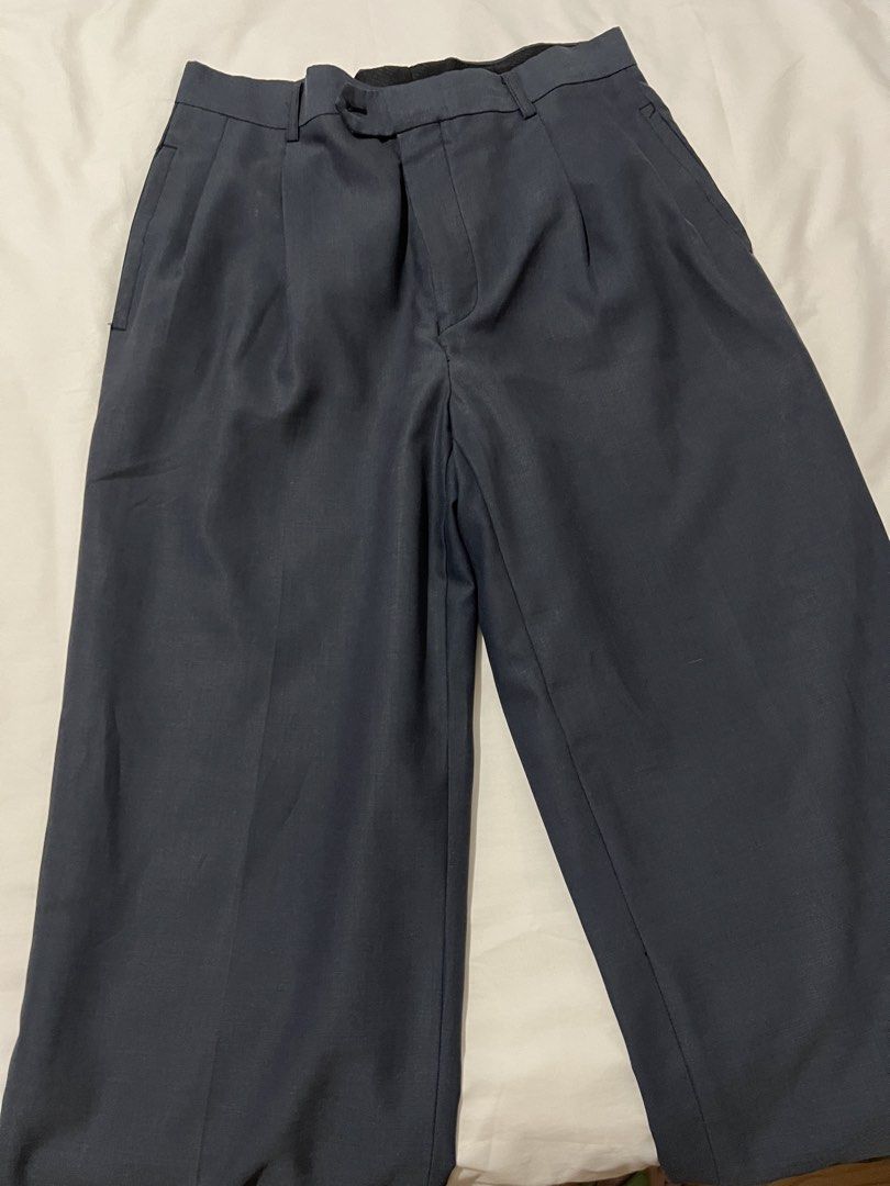 Dark Grey Pleated Wide Leg Trousers (Category: Other Bottoms) located in Pasig City. Submitted by shop.rdm (Listing ID 1444078091, Image 2). Description: - Dark grey wide-leg trousers - Front pleats - Dress pants material - Side pockets - Button and zip front closure - Ideal for smart casual or work wear - Fits medium to large (up to size 30).