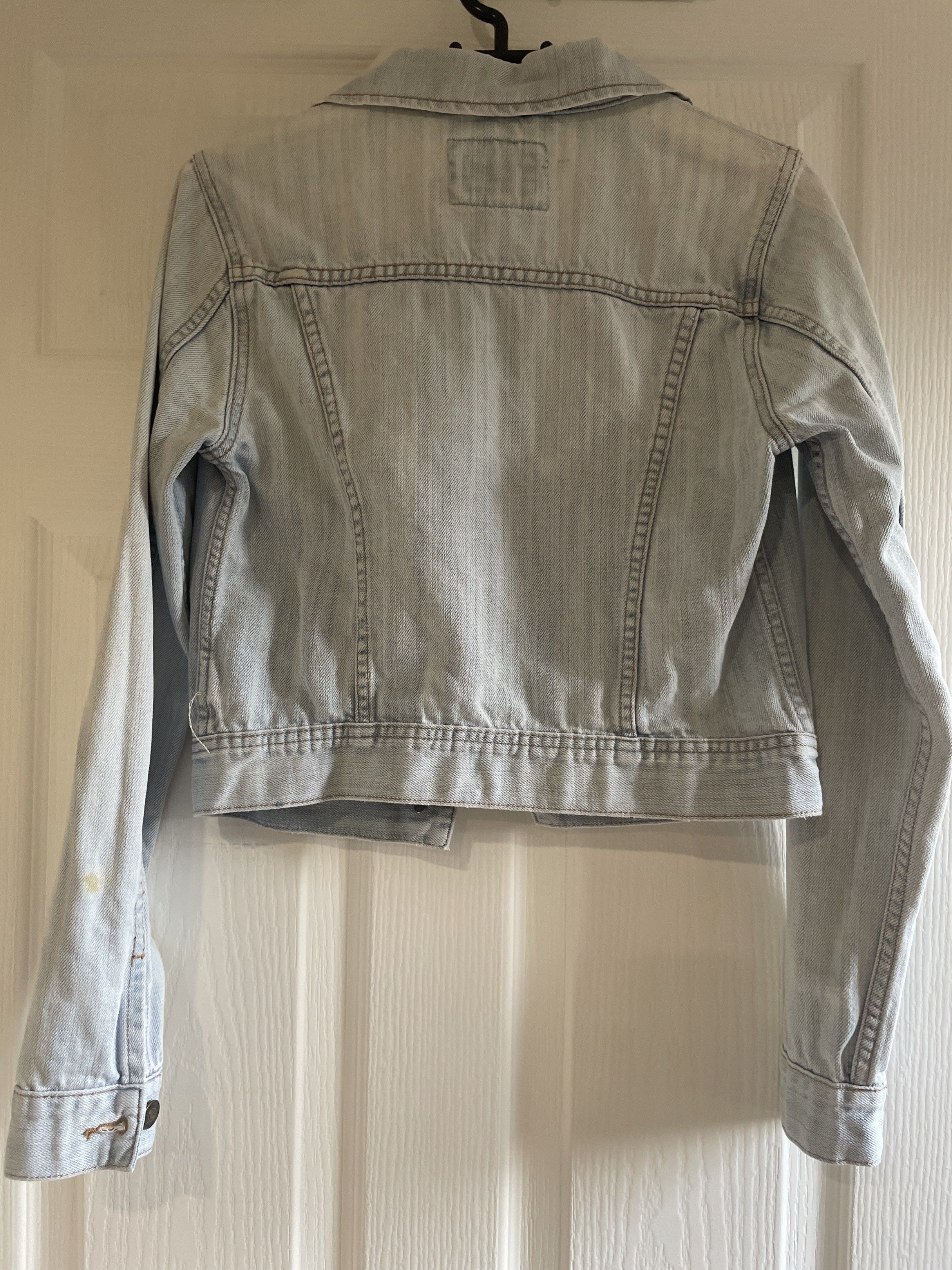 Denim Jacket S/P (Category: Coats, Jackets and Outerwear) located in San Juan City. Submitted by tabithajam (Listing ID 1443925421, Image 2). Description: - high quality Light wash denim jacket - Brand: I LOVE H81 - Style: Classic trucker - Closure: Button - Pockets: Chest pockets - Size: S/P - Condition: Good, with a small yellow stain on the left sleeve (visible in the last photo) For pick up in Greenhills .