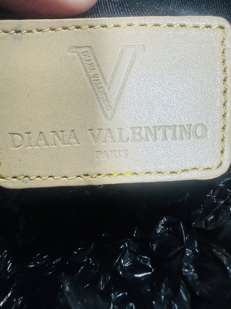 Diana Valentino Paris Monogram Shoulder Bag (Category: Purses & Pouches) located in Quezon City. Submitted by TGDL123 (Listing ID 1444034472, Image 3). Description: - Cute Diana Valentino Paris shoulder bag - Signature all-over monogram pattern - Gold hardware details - Zipper closure - Light tan colored strap - Small and compact, perfect for essentials.