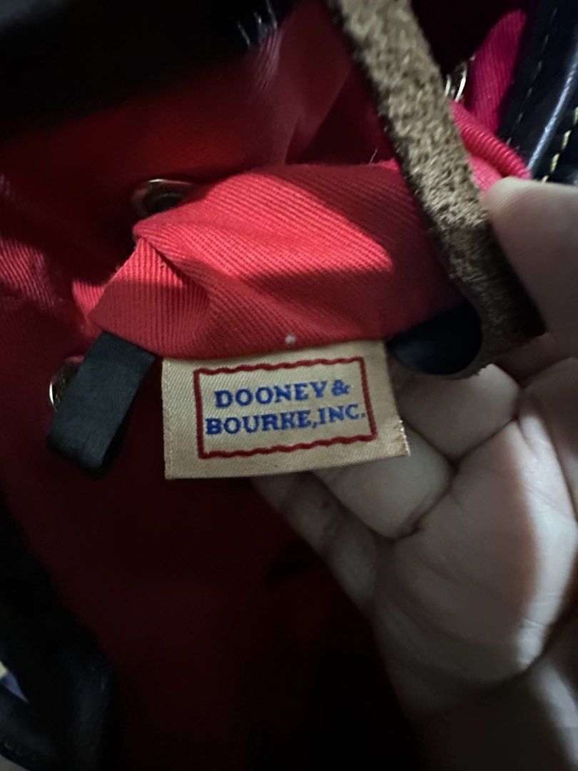 DOONEY & Bourkey Bucket Bag (Category: Luxury Bags & Wallets) located in General Santos City (Dadiangas). Submitted by prelovedpickers (Listing ID 1443920223, Image 3). Description: Selling This Preloved Dooney & Burkey Bucket bag animal print leather bag with wallet Description Dooney & Bourke Leather Zebra Print Leather Drawstring Bucket Purse 10" Heigh and 13 1/2" Wide Black and Tan Leather with Red Lining .