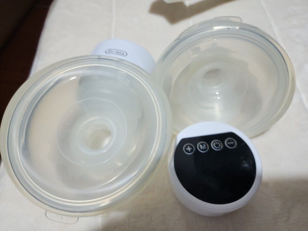 Dr. Isla Wearable Breast Pump Electric HandsFree (Category: Breastfeeding & Bottle Feeding) located in Manila. Submitted by realfurmom (Listing ID 1444026658, Image 2). Description: - Dr. Isla Wearable Breast Pump - Electric and Hands-Free Design - Comfortable Silicone Breast Cups - Includes Pump Motor and Breast Shields - Simple, Easy-to-Use Controls - Ideal for Pumping On-the-Go Yellowish already but still usable.