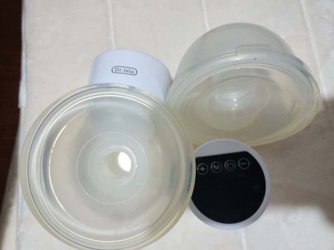 Dr. Isla Wearable Breast Pump Electric HandsFree (Category: Breastfeeding & Bottle Feeding) located in Manila. Submitted by realfurmom (Listing ID 1444026658, Image 1). Description: - Dr. Isla Wearable Breast Pump - Electric and Hands-Free Design - Comfortable Silicone Breast Cups - Includes Pump Motor and Breast Shields - Simple, Easy-to-Use Controls - Ideal for Pumping On-the-Go Yellowish already but still usable.