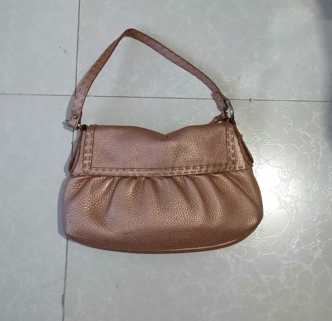 Fendi Spy Bag Rose Gold Leather (Category: Luxury Bags & Wallets) located in Manila. Submitted by braveturtle-540a03 (Listing ID 1443920752, Image 1). Description: - Authentic Fendi Spy Bag - Color: Rose Gold - Material: Pebbled Leather - Design: Gathered detail on the front - Closure: Magnetic snap - Interior: 1 zip pocket, 1 slip pocket - Authenticity: Comes with authenticity card - Includes: Original dust bag - Condition: Shows some signs of w