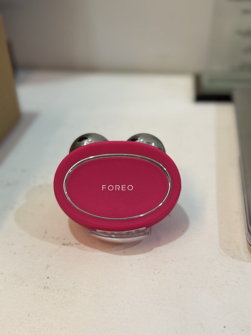 FOREO BEAR Microcurrent Facial Toning Device - Fuchsia (Category: Face Care) located in Bulacan. Submitted by klutterbykoko (Listing ID 1443942180, Image 1). Description: - ORIG PRICE: 23,980 PESOS - FOREO BEAR device in vibrant pink. - Utilizes microcurrent technology for effective facial toning. - Compact and user-friendly design for easy handling. - Comes complete with its original packaging. - An excellent addition to elevate your daily skinc