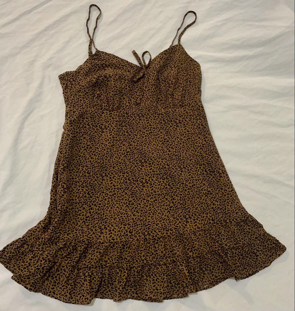 g.grace Leopard Print Mini Dress with Tie Front (Category: Dresses) located in Paranaque City. Submitted by vbvessentials (Listing ID 1444080383, Image 2). Description: - Adorable leopard print mini dress - Features adjustable spaghetti straps - Flattering tie-front detail at the bust - Playful ruffled hemline - Versatile for casual outings or nights out - Measurements: Pit to pit approx. 16 inches, Length approx. 32 inches large on tag but fits 