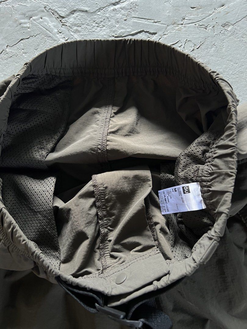 GU Cargo Shorts with Belt - Size M (Category: Shorts) located in Mabalacat. Submitted by sweatout.ph2025 (Listing ID 1443962563, Image 3). Description: - GU Cargo Shorts - Size: Medium (M) - Features: Elastic waistband with belt, multiple front and side pockets - Fabric: Lightweight and slightly crinkled - Ideal for: Casual wear, outdoor activities.