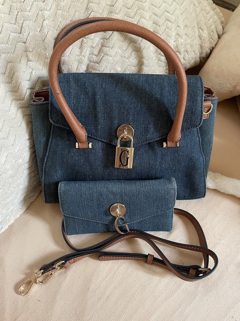 Guess Denim handbag with wallet (Category: Cross-body Bags) located in Pasig City. Submitted by Gshee (Listing ID 1443969116, Image 1). Description: GUESS Denim handbag + wallet set Original GUESS Purchased in Japan Complete with detachable shoulder strap and dustbag Bag in good condition, wallet with usage flaws Price negotiable.