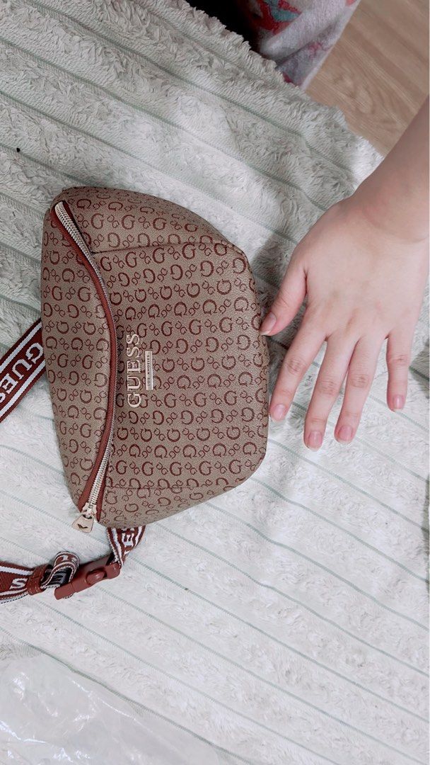 Guess Monogram Fanny Pack Belt Bag (Category: Cross-body Bags) located in Cavite. Submitted by butfirstdecluttering (Listing ID 1444019212, Image 3). Description: - Authentic Guess fanny pack - Stylish brown and red all-over monogram print - Adjustable strap with Guess branding - Secure zipper closure - Includes original dust bag and tag - Ideal for convenient, hands-free carrying Lalamove: gcash payment only JNT depende sa location for pick up d