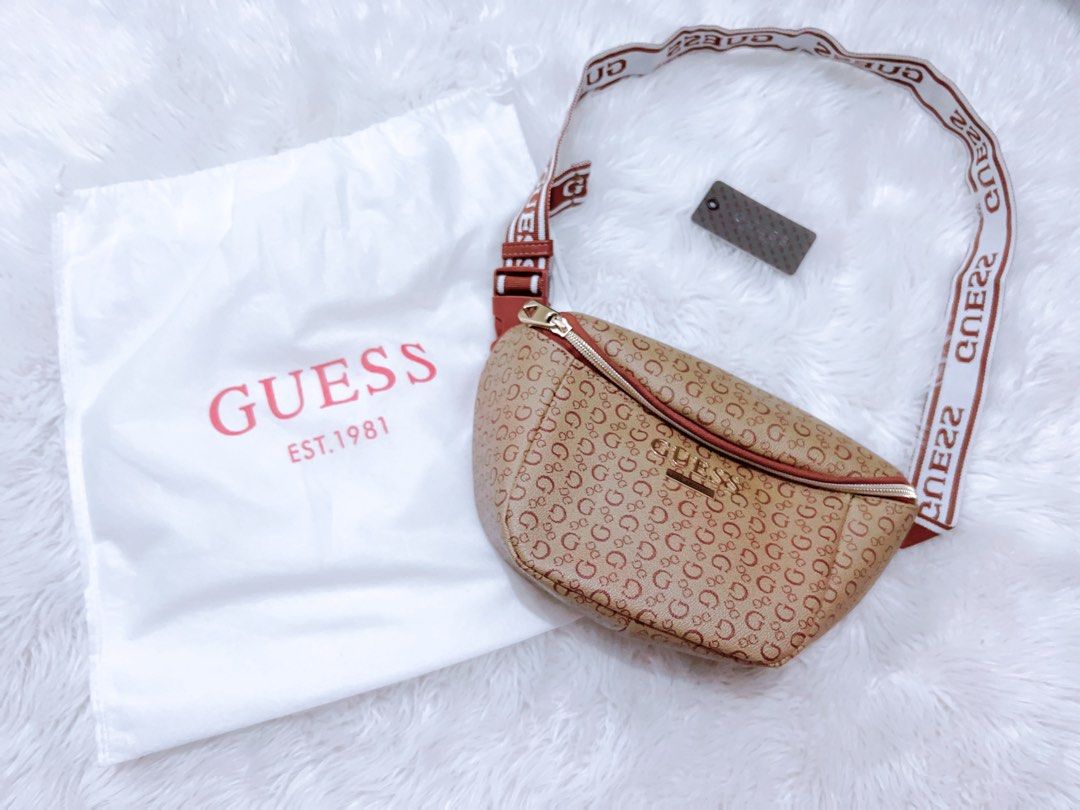 Guess Monogram Fanny Pack Belt Bag (Category: Cross-body Bags) located in Cavite. Submitted by butfirstdecluttering (Listing ID 1444019212, Image 2). Description: - Authentic Guess fanny pack - Stylish brown and red all-over monogram print - Adjustable strap with Guess branding - Secure zipper closure - Includes original dust bag and tag - Ideal for convenient, hands-free carrying Lalamove: gcash payment only JNT depende sa location for pick up d
