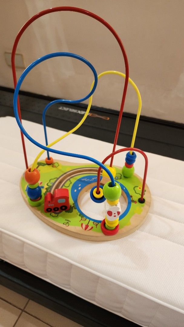 Hape wooden toy (Category: Educational & Learning Toys) located in Makati City. Submitted by carwtan90 (Listing ID 1444108823, Image 1). Description: - Fun wooden bead maze toy for little ones. - Features colorful beads sliding along wires. - Includes a little red car and animal graphics. - Great for developing fine motor skills and hand-eye coordination. - Perfect for toddlers and preschoolers. - Easy to handle and play with..