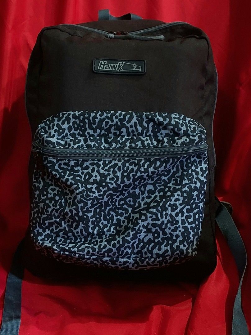 Hawk Backpack with Leopard Print Accents,school bag, office bag (Category: Backpacks) located in Taytay. Submitted by ForQueens (Listing ID 1444103653, Image 1). Description: - Brand: Hawk - Design: Features a cool leopard print on the front pocket and shoulder straps. - Compartment: Spacious main compartment. - Condition: Zippers work well. - Features: Adjustable shoulder straps. - Ideal for: School or everyday use. 💕Prelove.Please manage your 