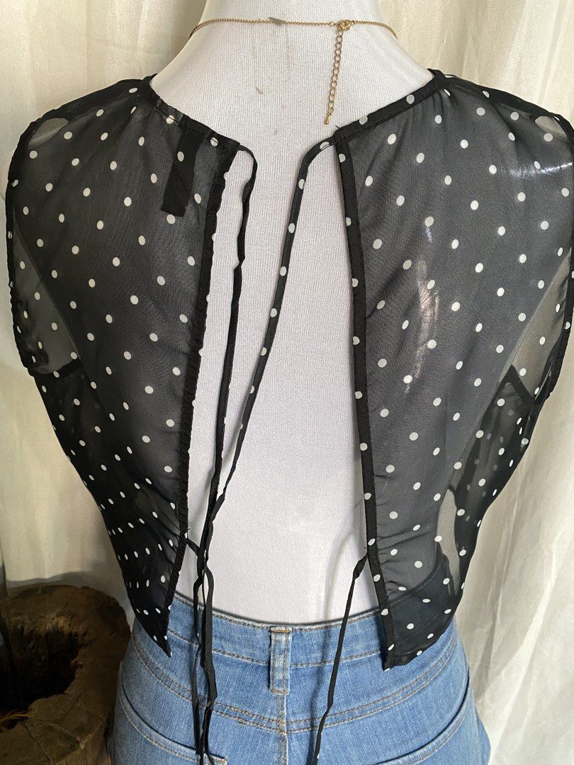 H&M Divided Black Polka Dot Sheer Mesh Crop Top (Category: Others Tops) located in Manila. Submitted by cami0110 (Listing ID 1444011637, Image 3). Description: - Black sheer mesh crop top - White polka dot pattern - Sleeveless design - Tie-back closure - Lightweight and airy - Brand: H&M Divided - Ideal for layering over bralettes or camisoles.