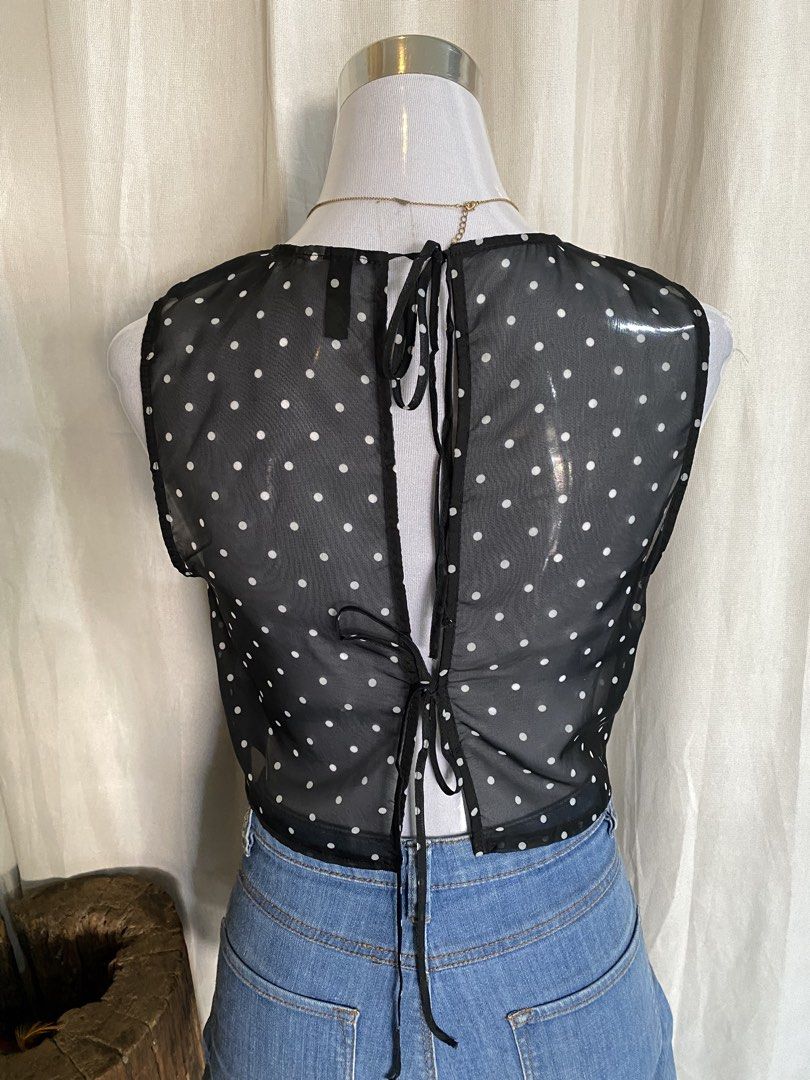 H&M Divided Black Polka Dot Sheer Mesh Crop Top (Category: Others Tops) located in Manila. Submitted by cami0110 (Listing ID 1444011637, Image 2). Description: - Black sheer mesh crop top - White polka dot pattern - Sleeveless design - Tie-back closure - Lightweight and airy - Brand: H&M Divided - Ideal for layering over bralettes or camisoles.