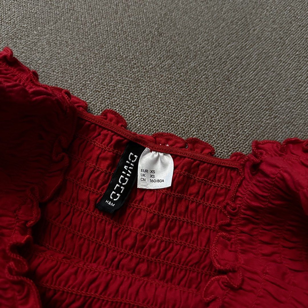 H&M Divided red smocked off-shoulder crop top (Category: Others Tops) located in Batangas. Submitted by veevasclutter (Listing ID 1444065924, Image 2). Description: • red smocked crop • off-shoulder with short sleeves • very stretchy • bust: 11.5in, length: 9.5in.