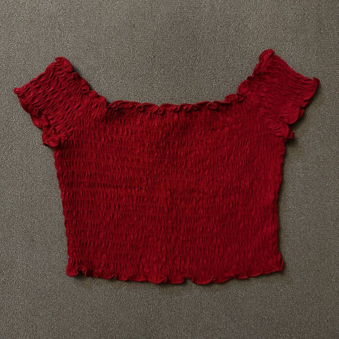 H&M Divided red smocked off-shoulder crop top (Category: Others Tops) located in Batangas. Submitted by veevasclutter (Listing ID 1444065924, Image 1). Description: • red smocked crop • off-shoulder with short sleeves • very stretchy • bust: 11.5in, length: 9.5in.