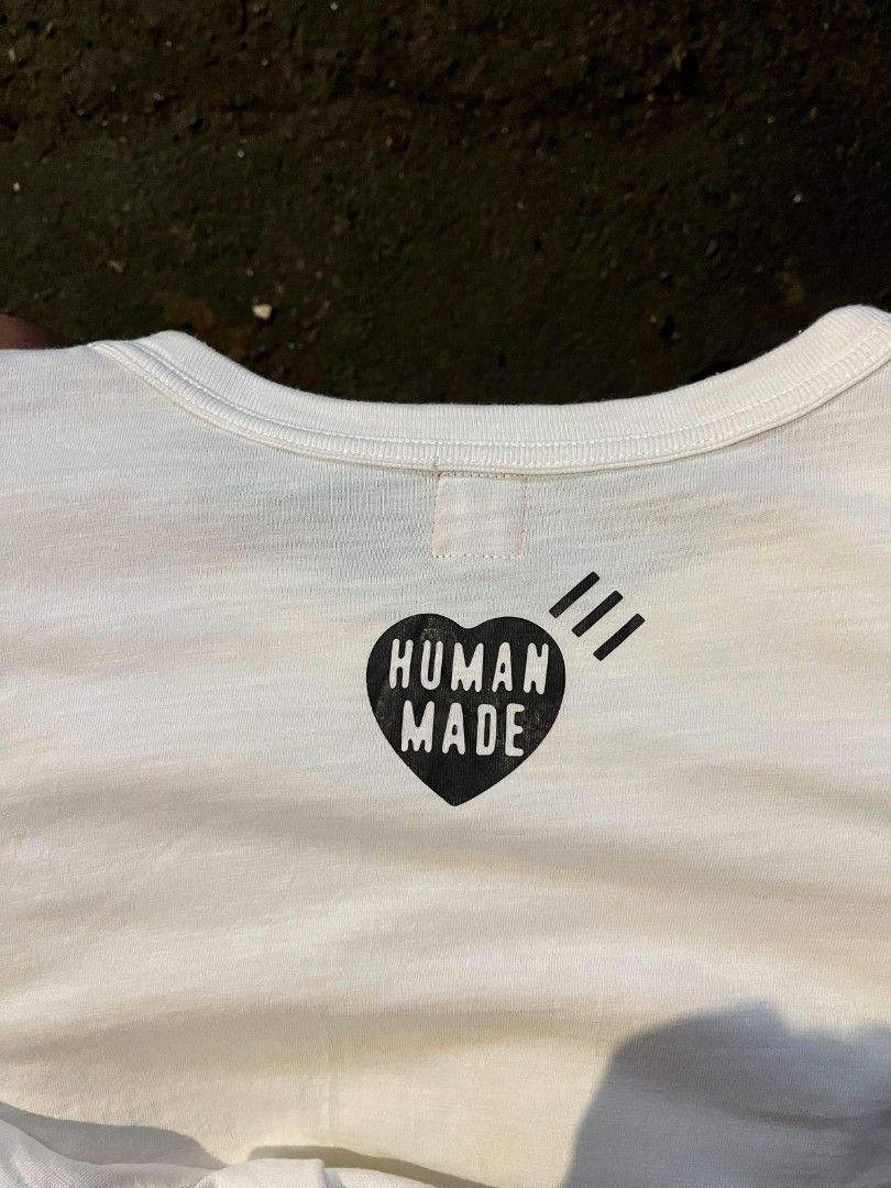 Human Made Duck Graphic T-Shirt White Medium (Category: Tshirts & Polo Shirts ) located in Manila. Submitted by harveyyay07523 (Listing ID 1444048698, Image 2). Description: - White Human Made T-shirt - Tagged Medium - Features classic duck graphic on front - Human Made heart logo on back - Made in Japan - Essential for any streetwear collection - Please check photos for condition details.