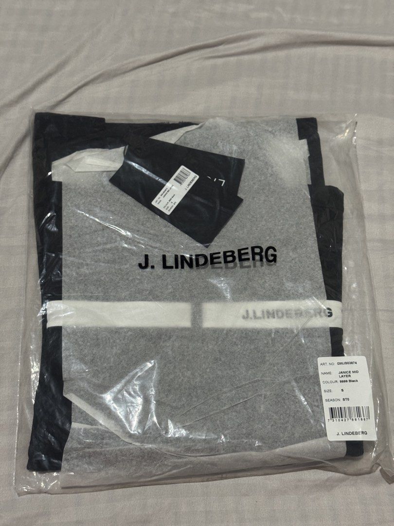 J. Lindeberg Janice Ladies Golf Mid Layer Jacket Black (Category: Coats, Jackets and Outerwear) located in Cainta. Submitted by trufflecake (Listing ID 1443997661, Image 3). Description: - J. Lindeberg Janice Ladies Golf Mid Layer jacket - Color: Black with white stripe detail - Condition: Brand new with tags attached - Versatile: Great for golf or casual wear - Size: S.