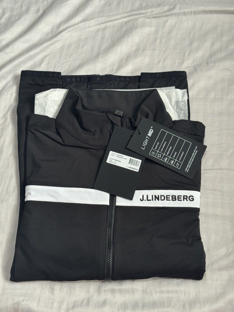 J. Lindeberg Janice Ladies Golf Mid Layer Jacket Black (Category: Coats, Jackets and Outerwear) located in Cainta. Submitted by trufflecake (Listing ID 1443997661, Image 2). Description: - J. Lindeberg Janice Ladies Golf Mid Layer jacket - Color: Black with white stripe detail - Condition: Brand new with tags attached - Versatile: Great for golf or casual wear - Size: S.
