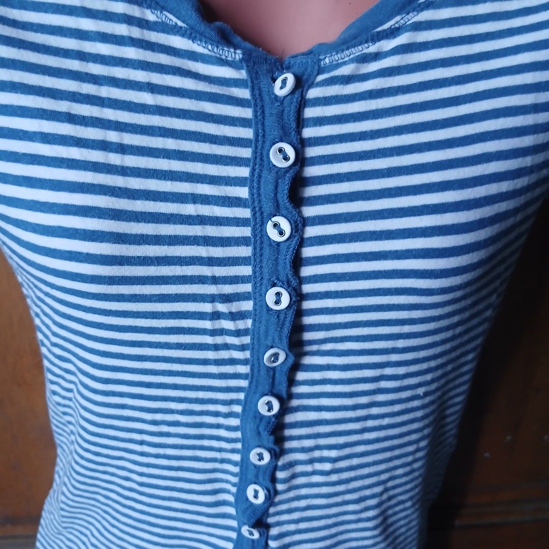 Joloe Grunge Y2K Striped Button Up Top Size (Category: Blouses) located in Badoc. Submitted by gondelions (Listing ID 1443966192, Image 2). Description: - Blue and white striped top from Joloe - Short sleeves - Button-up front - Cute ruffled neckline - Made in Vietnam - Size S - Great for casual wear.