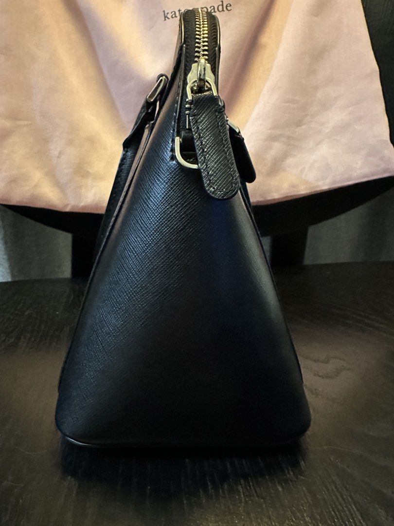 Kate Spade Black Leather Dome Satchel Bag with Strap (Category: Luxury Bags & Wallets) located in Muntinlupa City. Submitted by zanne426 (Listing ID 1444054821, Image 3). Description: - Authentic Kate Spade black dome satchel - Made of premium saffiano leather - Comfortable top handles - Detachable and adjustable crossbody strap for versatile wear - Secure zipper closure - Convenient front zip pocket - Comes with original dust bag and tags - Idea