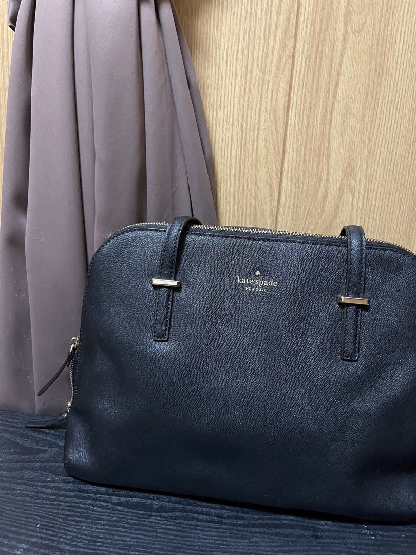 Kate Spade Black Leather Satchel Handbag (Category: Luxury Bags & Wallets) located in Manila. Submitted by thatgirlkhyre (Listing ID 1444025148, Image 3). Description: - Classic black Kate Spade satchel - Durable Saffiano leather - Top handles and zip closure - Elegant gold hardware details - Spacious interior for essentials - Ideal for work or everyday wear - A timeless and versatile piece.