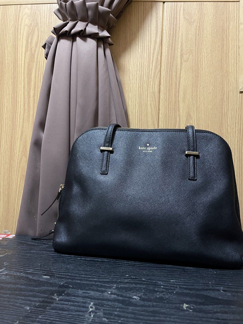 Kate Spade Black Leather Satchel Handbag (Category: Luxury Bags & Wallets) located in Manila. Submitted by thatgirlkhyre (Listing ID 1444025148, Image 2). Description: - Classic black Kate Spade satchel - Durable Saffiano leather - Top handles and zip closure - Elegant gold hardware details - Spacious interior for essentials - Ideal for work or everyday wear - A timeless and versatile piece.