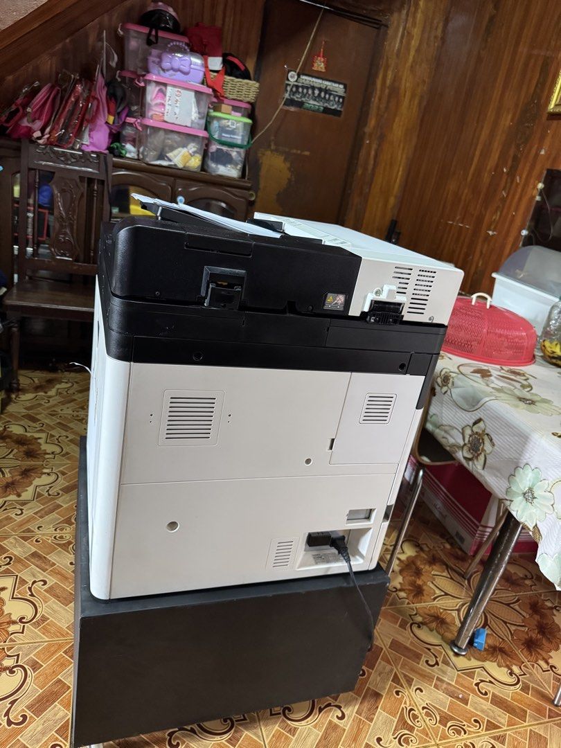 Kyocera ECOSYS M4125idn Multi-Function Laser Printer (Category: Printers, Scanners & Copiers) located in Manila. Submitted by marquezpa52205 (Listing ID 1444034776, Image 2). Description: - Kyocera multifunction printer - Functions: Print, Copy, Scan - Condition: Good working order - Features: Touchscreen display, keypad controls - Includes: Black cabinet with storage - Ideal for: Office or home use.